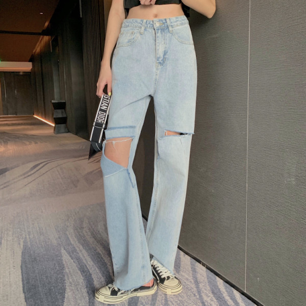 Lengvi moteriški džinsai su plėšytais motyvais ir aukštu liemeniu