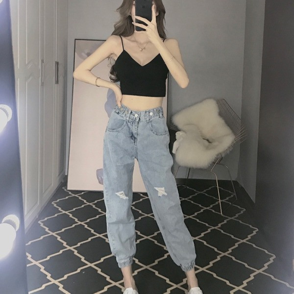 Elastsete ja rebenenud motiividega vabaaja naiste teksad