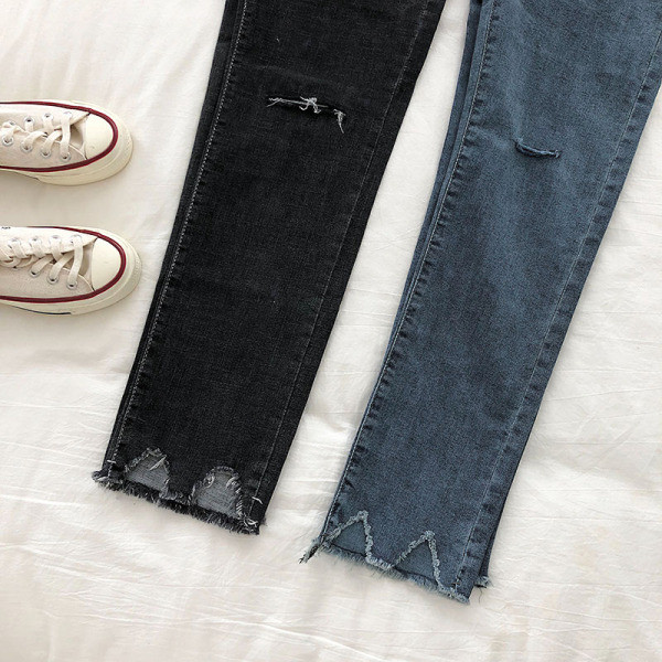 Kõrge vöökoha ja rebenenud motiividega vabaaja teksapükste sirge mudel