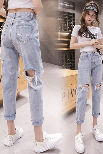 Sieviešu ikdienas džinsi ar saplēstu motīvu un augstu vidukli zilā krāsā