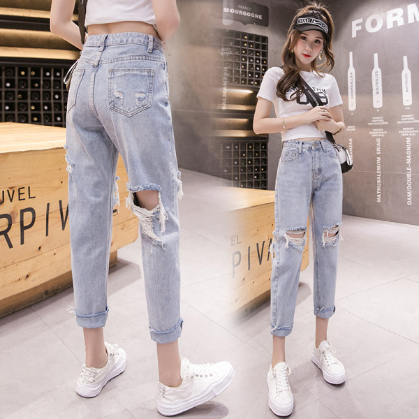 Sieviešu ikdienas džinsi ar saplēstu motīvu un augstu vidukli zilā krāsā