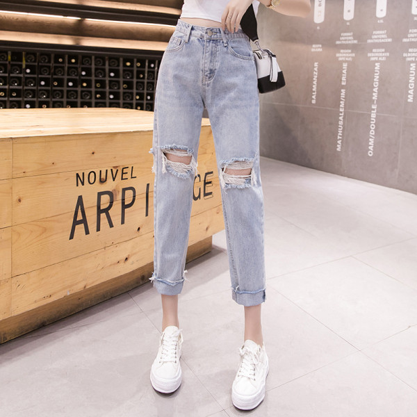 Sieviešu ikdienas džinsi ar saplēstu motīvu un augstu vidukli zilā krāsā