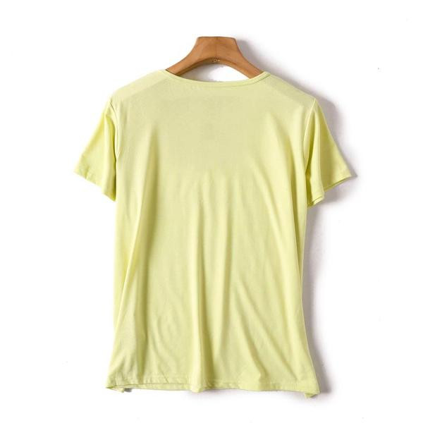 Lihtne kollane T-särk kirja ja lühikeste varrukatega