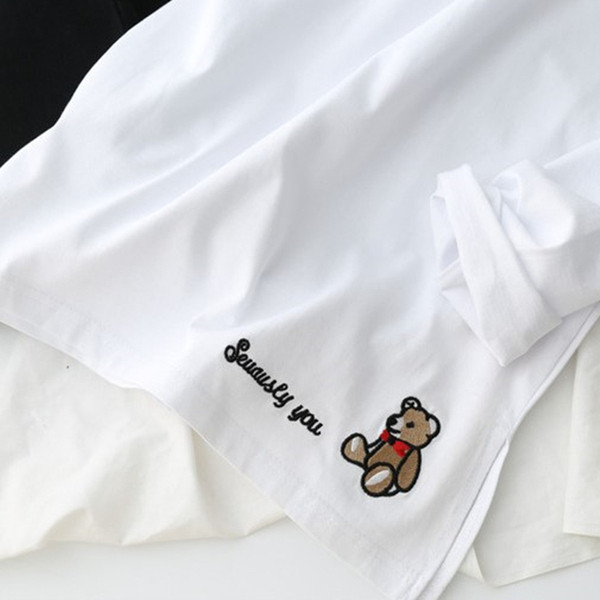 Bluză de damă albă cu mâneci lungi și broderie colorată