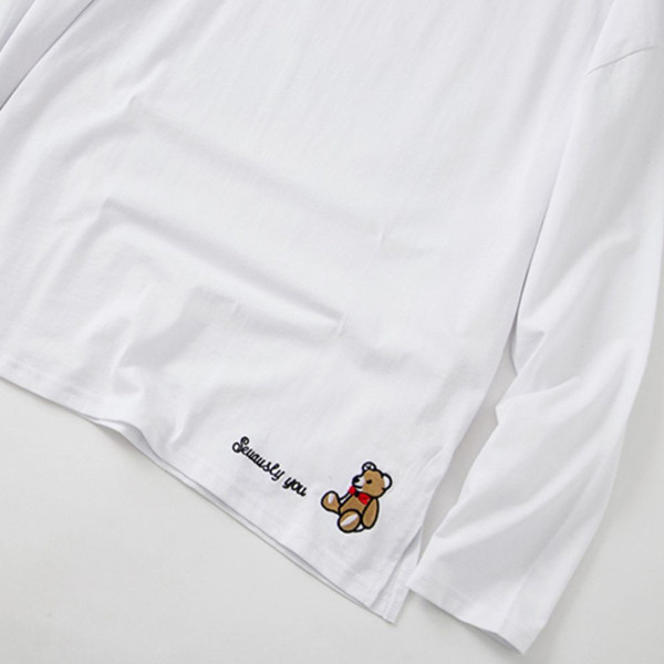 Bluză de damă albă cu mâneci lungi și broderie colorată