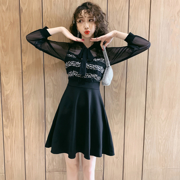 Ženska crna haljina sa šljokicama i dugim rukavima