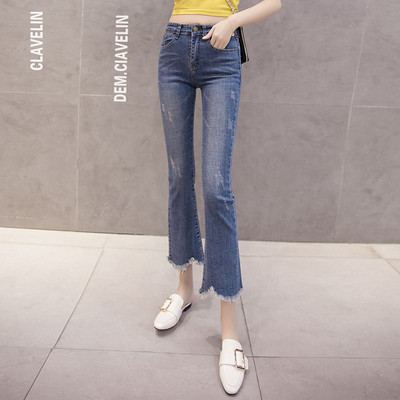 Női alkalmi farmer magas derékkal, szakadt mintával, kék színben