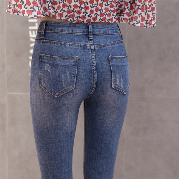 Női alkalmi farmer magas derékkal, szakadt mintával, kék színben