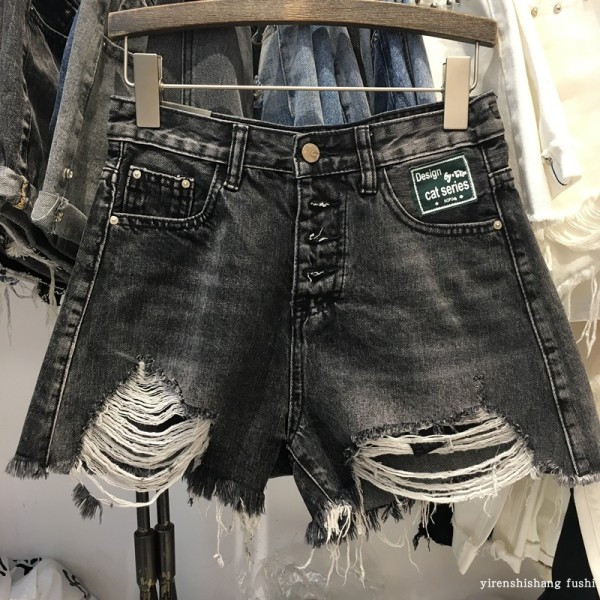 Női alkalmi farmer nadrág szakadt motívumokkal, fekete színben