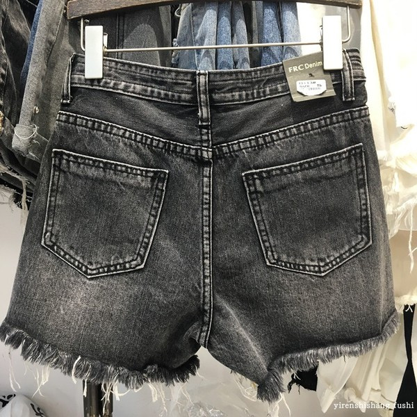 Női alkalmi farmer nadrág szakadt motívumokkal, fekete színben