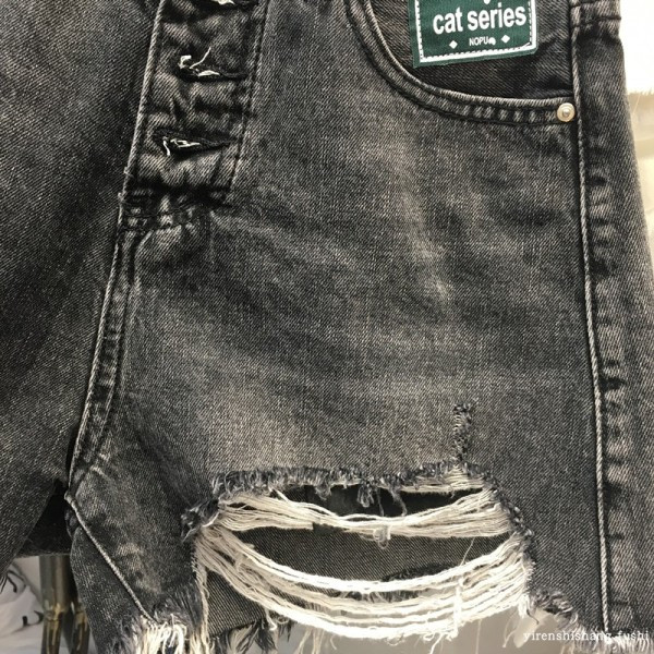 Női alkalmi farmer nadrág szakadt motívumokkal, fekete színben