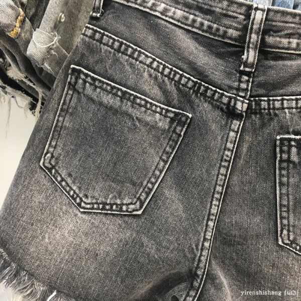 Női alkalmi farmer nadrág szakadt motívumokkal, fekete színben