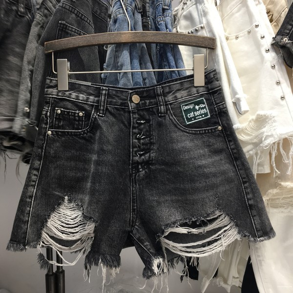 Női alkalmi farmer nadrág szakadt motívumokkal, fekete színben