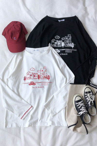 Széles női blúz, hosszú ujjal és mintával