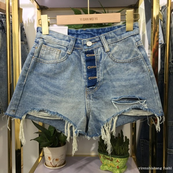 Moderne ženske traperice sa poderanim motivima i visokim strukom