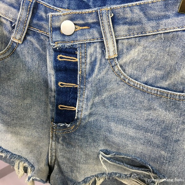 Moderne ženske traperice sa poderanim motivima i visokim strukom