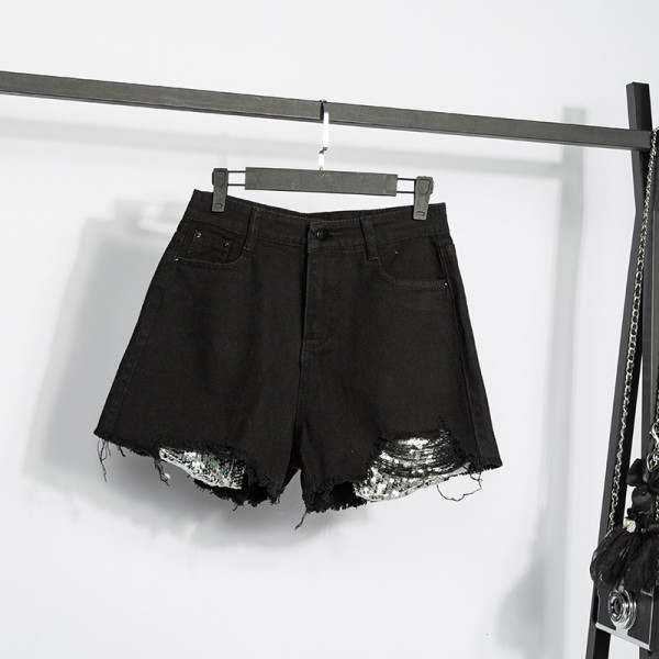 Didelio dydžio moteriški šortai aukštu liemeniu, plėšytais motyvais ir blizgučiais