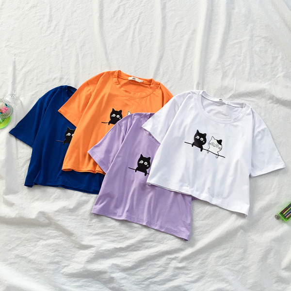 Laisva moteriška palaidinė su apvalia iškirpte ir aplikacijomis