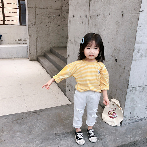 Pavasariniai vaikiški džinsai mergaitėms su tampriu juosmeniu ir plėšytais motyvais