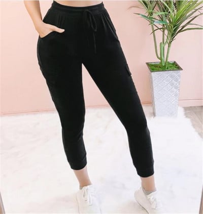 Laisvalaikio moteriškos kelnės aukštu juosmeniu, kišenėmis ir kaklaraiščiais