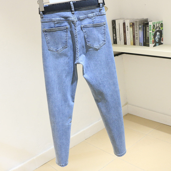 Laisvalaikiai moteriški džinsai Liekno modelio aukštu juosmeniu