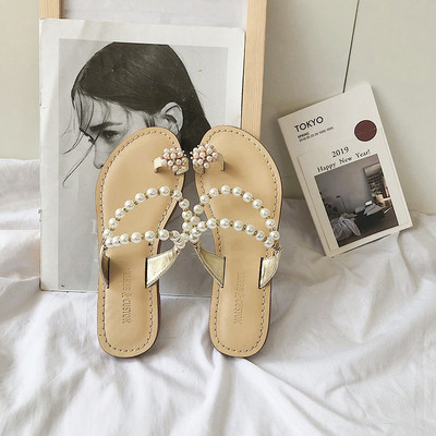 Ženske sandale s ravnim potplatom i elementom bisera