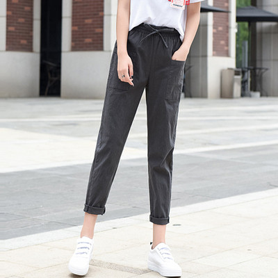 Ležerne ženske hlače ravnog modela s vezicama i džepovima