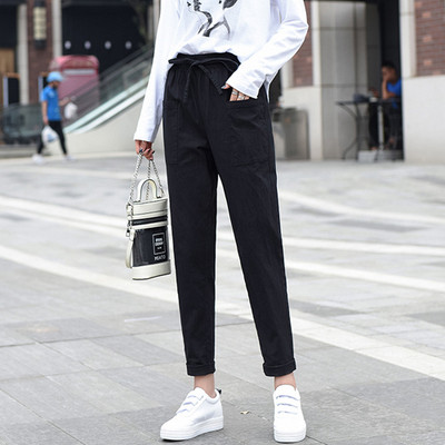 Ležerne ženske hlače ravnog modela s vezicama i džepovima