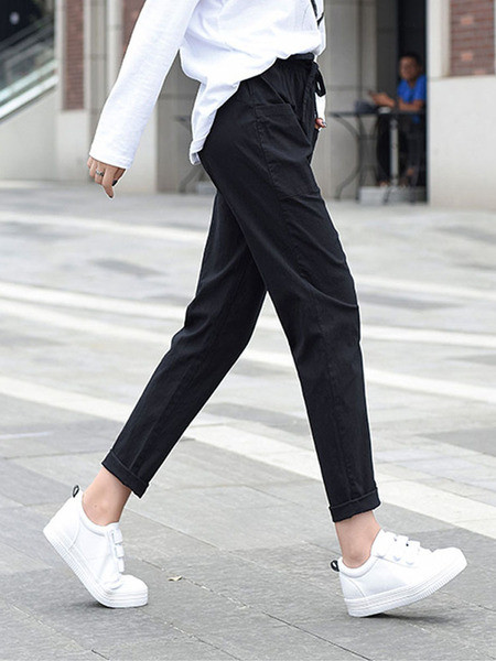 Ležerne ženske hlače ravnog modela s vezicama i džepovima