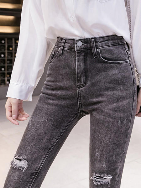 Moteriški dabartiniai džinsai su plėšytais motyvais Slim modelis