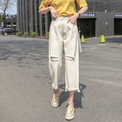 Sieviešu aktuālais džinsu 9/10 garuma plats modelis ar saplēstiem motīviem