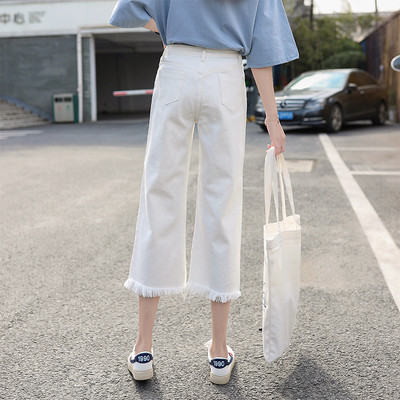 Sieviešu aktuālais džinsu 9/10 garuma plats modelis ar saplēstiem motīviem