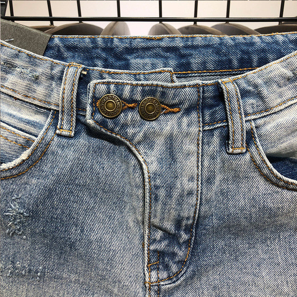 Női farmer rövidnadrág szakadt motívumokkal