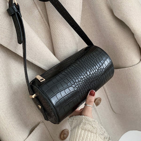 Apvalus moteriškas krepšys iš dirbtinės odos su įspaustu viršeliu ir ilga rankena