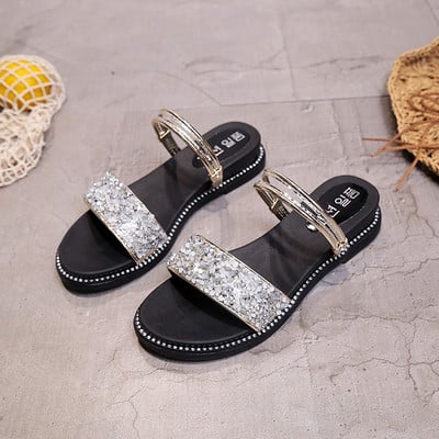 Ikdienas sieviešu sandales ar spīdīgām daļiņām un plakanu zoli