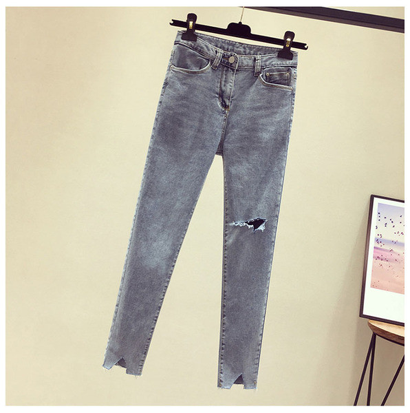 Sieviešu garie džinsi ar augstu vidukli un plēstiem motīviem