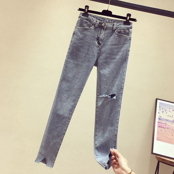 Sieviešu garie džinsi ar augstu vidukli un plēstiem motīviem