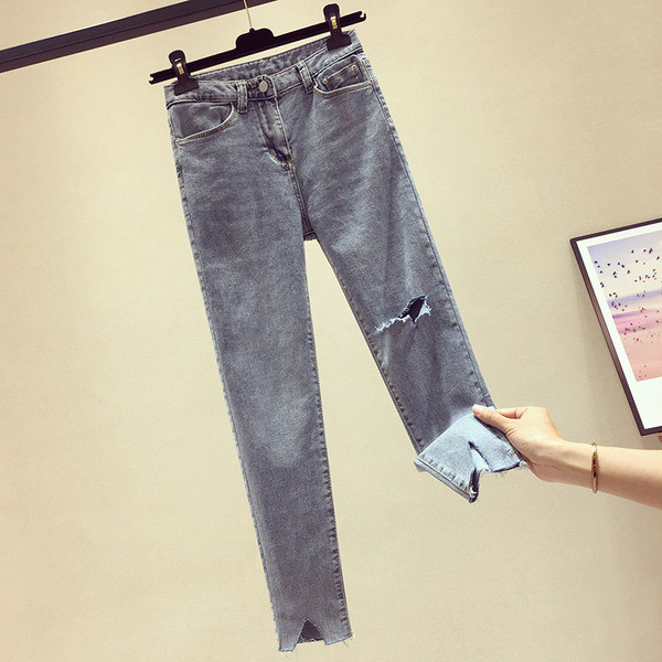 Sieviešu garie džinsi ar augstu vidukli un plēstiem motīviem