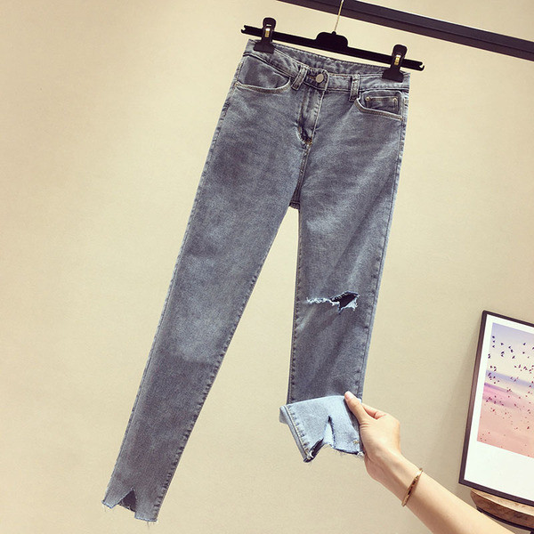 Sieviešu garie džinsi ar augstu vidukli un plēstiem motīviem