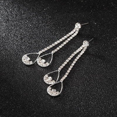 Modernūs moteriški kabantys auskarai su sidabriniais akmenukais