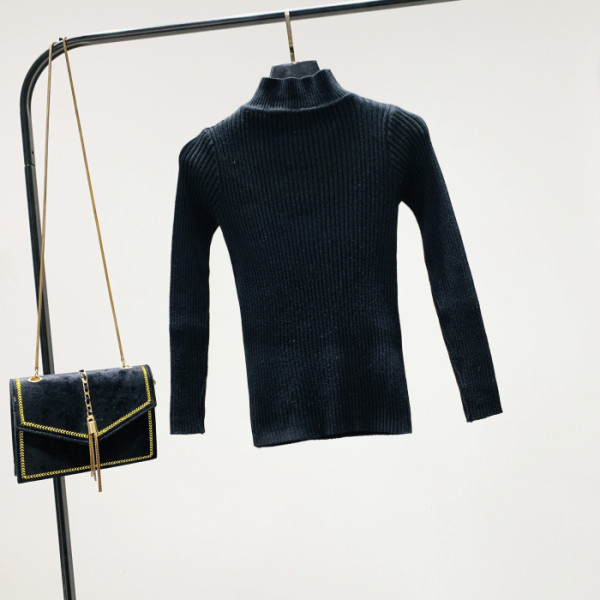 Pulover de damă modern cu guler înalt și părți decupate