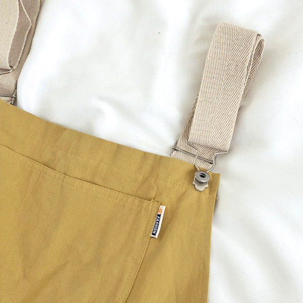 Női alkalmi kombiné széles pántokkal és zsebbel