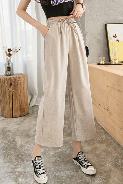 Női nadrág magas derékkal és megkötővel