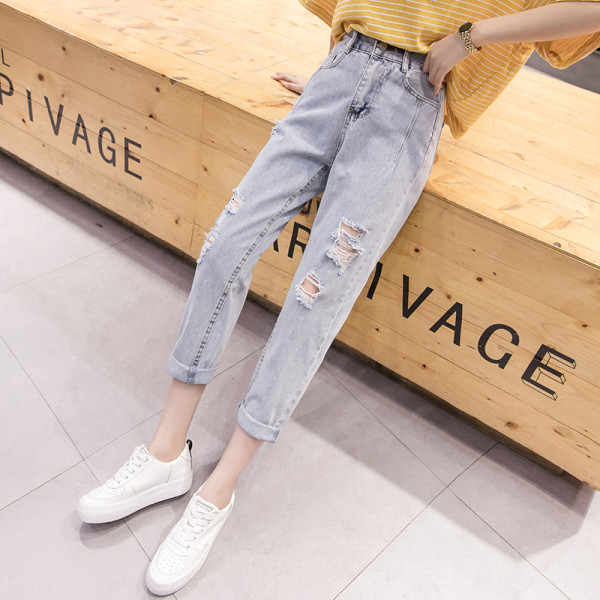 Női farmer gumírozott derékkal, jobbra szakadt