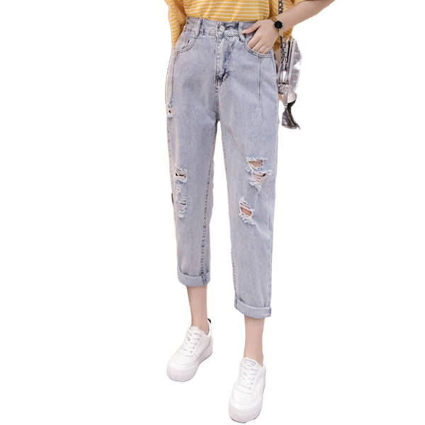 Női farmer gumírozott derékkal, jobbra szakadt