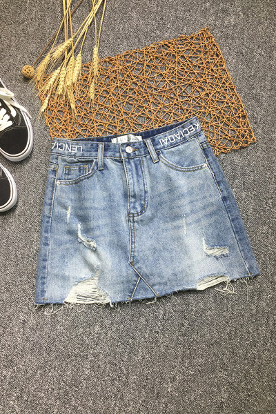 Női farmerszoknya, magas derékkal, szakadt motívumokkal