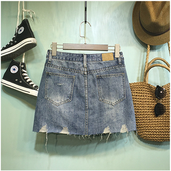 Női farmerszoknya, magas derékkal, szakadt motívumokkal