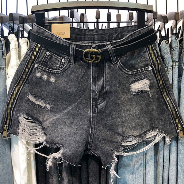 Női farmer rövidnadrág cipzárral és övvel