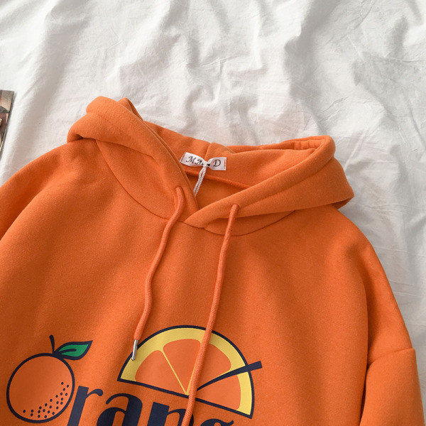 Napi női pulóver zsebbel és rátéttel