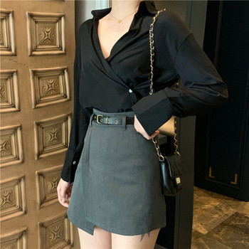 Asimetrična ženska suknja s visokim strukom i kožnim remenom